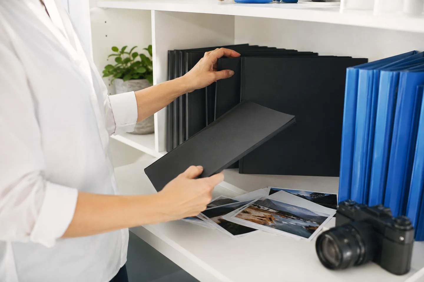 A producer organizing materials for a series of training videos.