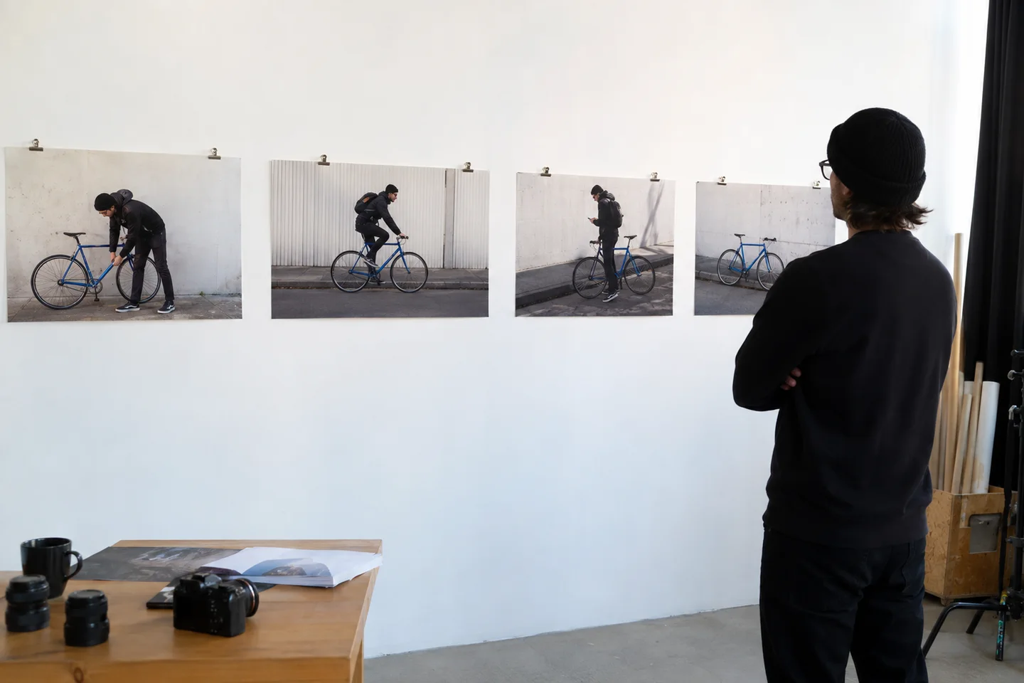 A filmmaker checking the coherence of a four-part bicycle story.