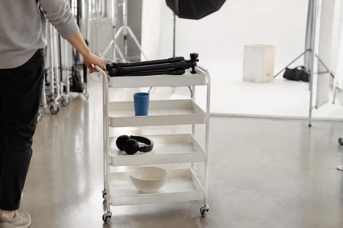 An organized prop cart being moved toward a short-video filming set.