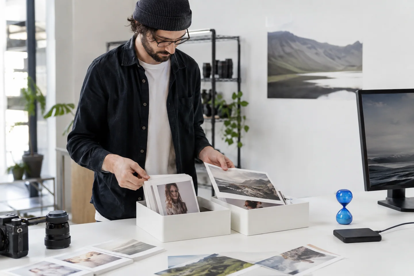 A producer sorting source images and portrait clips for delivery.