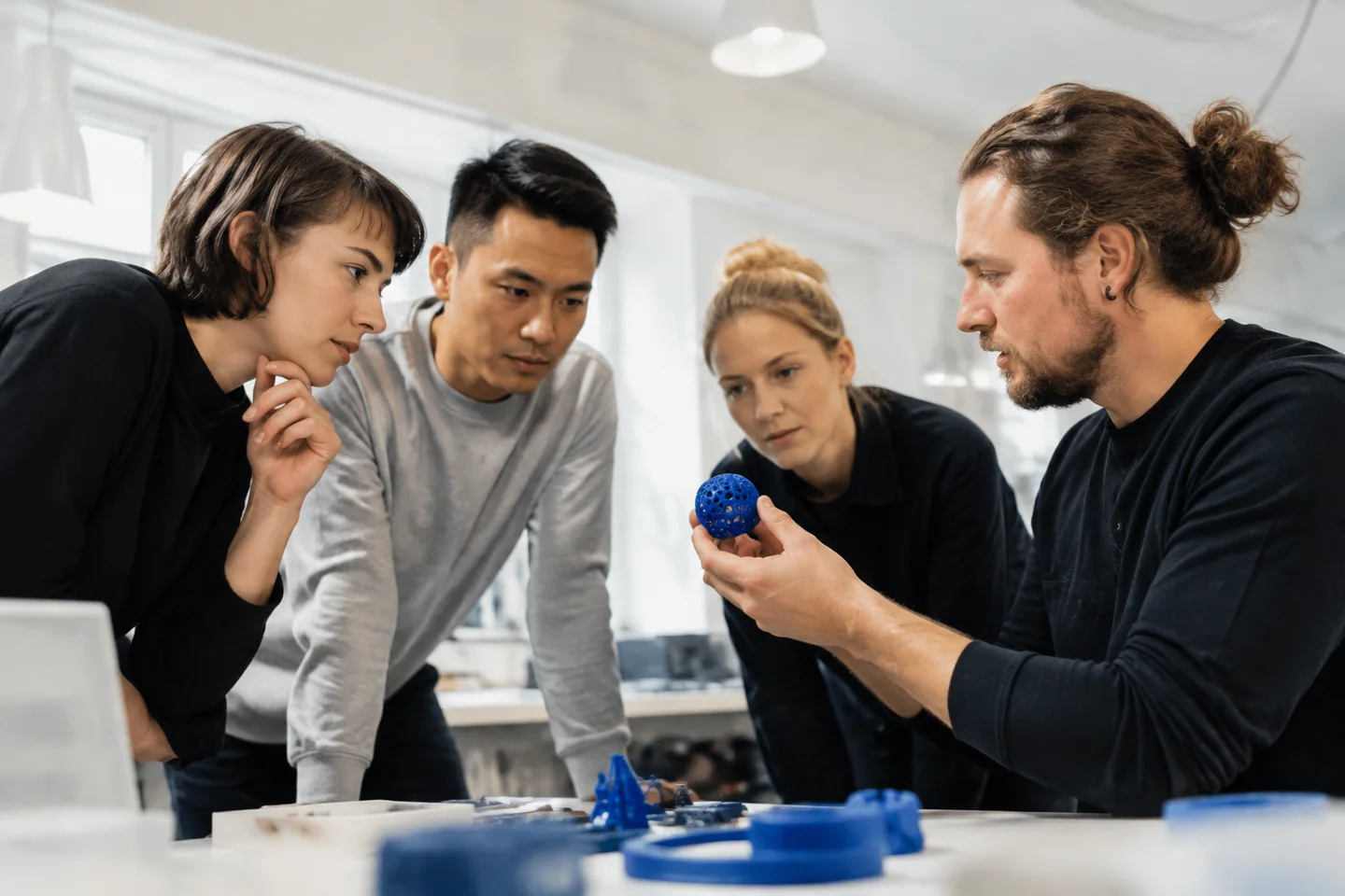 A small group paying close attention to a product demonstration.